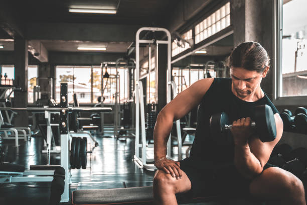 istock Young handsome man doing exercises in gym. 1152115778