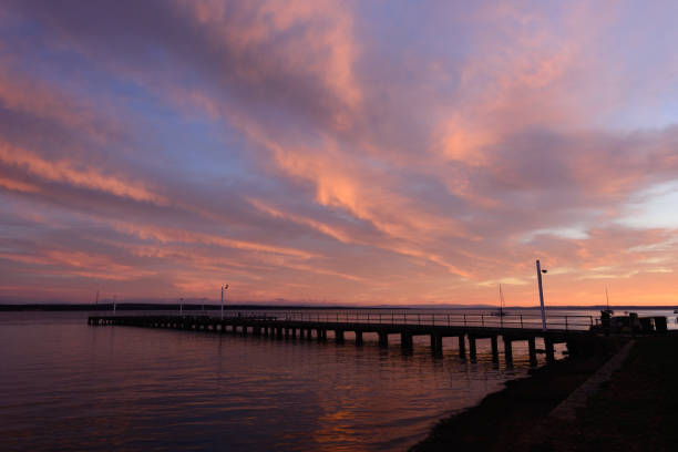 istock Corinella pier at sunrise viewed from the side 1152118963