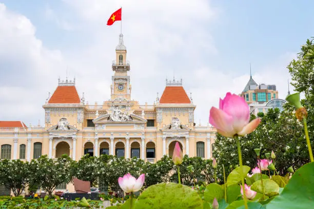 Photo of Saigon City Hall and lotuses