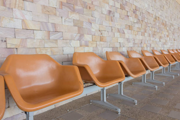 istock Row of empty seats with stone wall 1152120009
