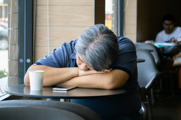 istock Frustrated middle aged man  sitting at coffee shop. 1152121441
