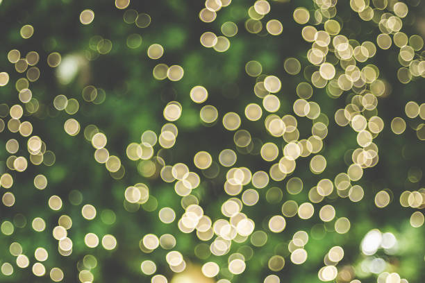 Abstract blur decoration ball and light string on christmas tree with bokeh light background.winter holiday seasonal.