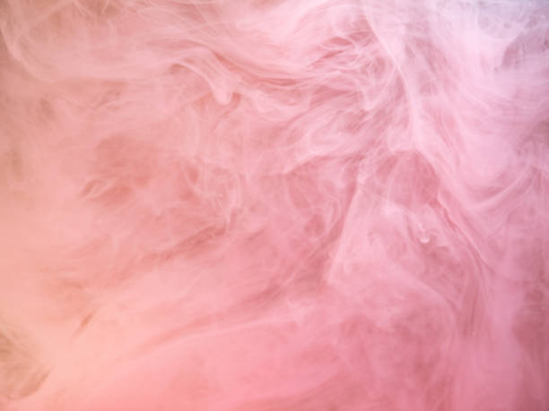 istock Abstract pink smoke swirling under water, close up view. Blurred background. Acrylic paint dissolving into water, abstract pattern. Pink ink dropped into liquid, abstract art background. 1152122570