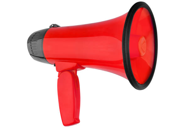 istock Red megaphone on white background isolated close-up, hand loudspeaker design, red loudhailer or speaking trumpet illustration, announcement or agitation symbol, media or communication icon, alert sign 1152122627