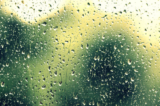 istock Water drops on glass during a rain close up. Natural background 1152124182