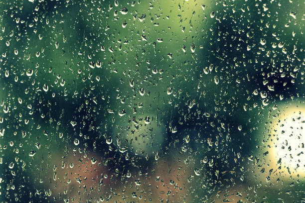 istock Water drops on glass during a rain close up. Natural background 1152124186