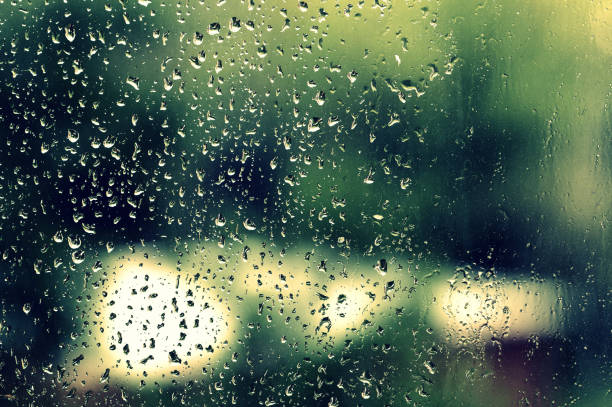 istock Water drops on glass during a rain close up. Natural background 1152124189