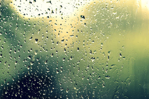 istock Water drops on glass during a rain close up. Natural background 1152124191