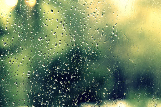 istock Water drops on glass during a rain close up. Natural background 1152124193