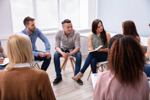 istock Three Men Sitting Together Counseling 1152125086