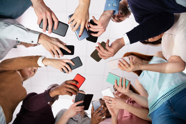istock Low Angle View Of Hands Holding Cellphone 1152125114