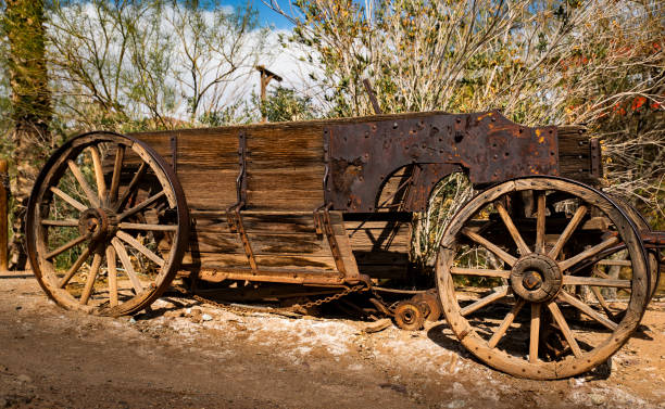 istock Old rusted wooden wagon in the desert 1152131168
