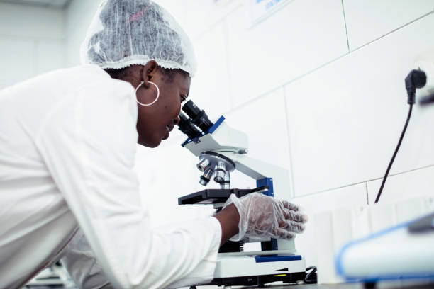 istock STEM - Girl Using Microscope at a Science Laboratory at an Institute in Africa 1152131218