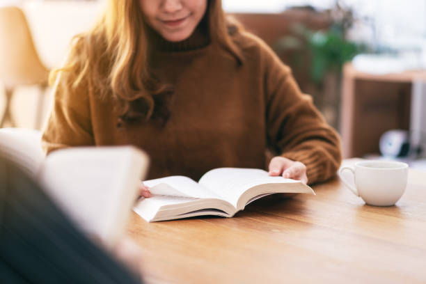 istock people sitting and enjoyed reading book together 1152131349