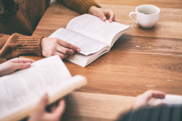 istock people sitting and enjoyed reading book together 1152131354