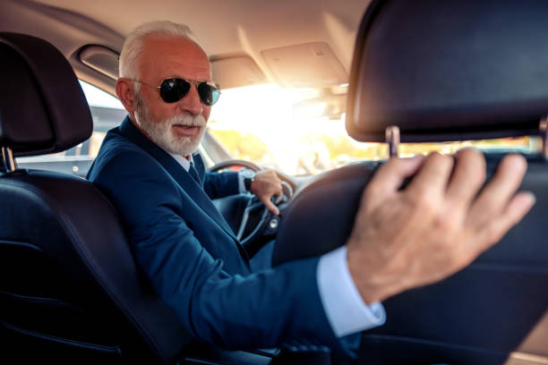 istock Senior businessman driving a car 1152131379