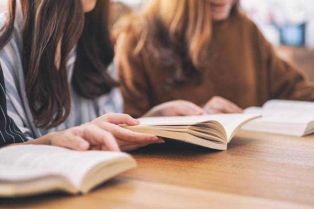 istock young people sitting and enjoyed reading books together 1152131386