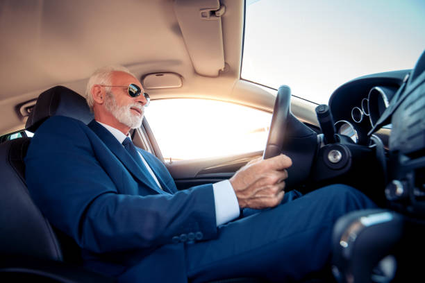 istock Senior businessman driving a car 1152131433