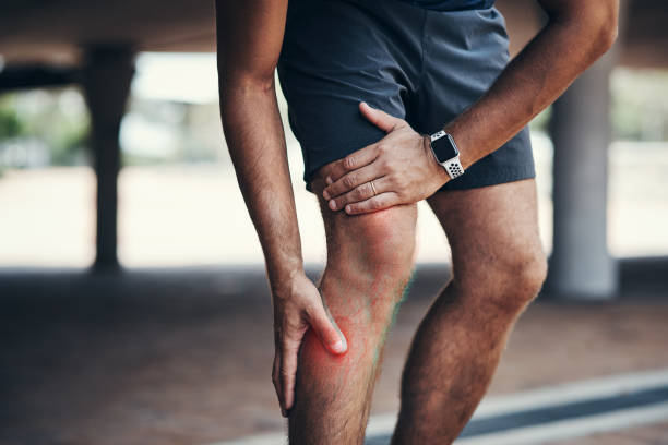 I first need to deal with this injury before I continue Closeup shot of an unrecognizable man holding his leg in pain while exercising outdoors shin stock pictures, royalty-free photos & images