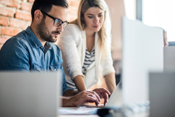 istock Business colleagues cooperating while working on laptop in the office. 1152133455