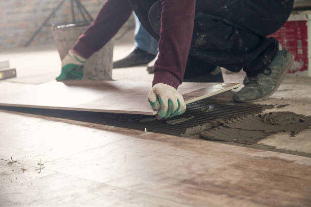 istock Laying floor ceramic tile. Renovating the floor 1152134807