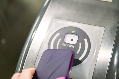 Using Qr Code On Smartphone To Open Automatic Gate Machine Stock Photo ...