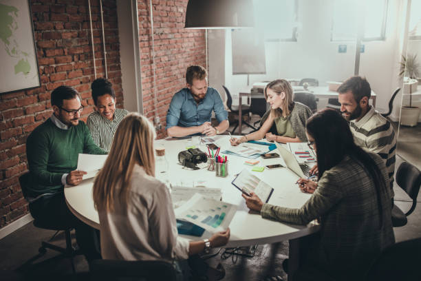 istock Large group of business people working on reports in the office. 1152135659
