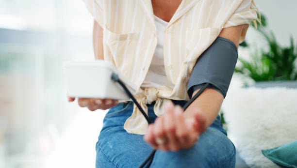 I hope my blood pressure came down... Cropped shot of a woman checking her blood pressure at home blood pressure medication stock pictures, royalty-free photos & images
