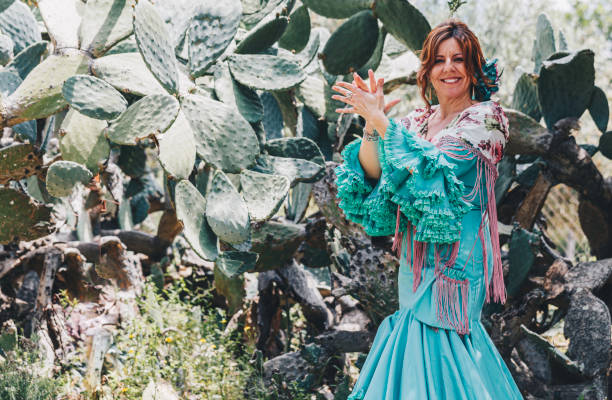Woman dressed in flamenco playing palms