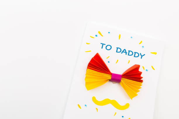 istock Happy fathers day sign on paper  laid on white backround. - Image 1152142902