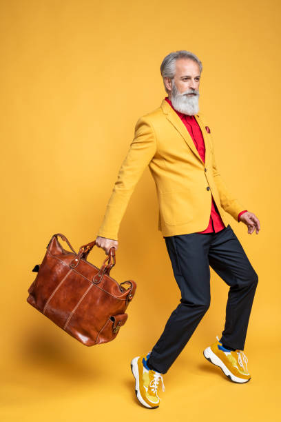 istock Happy well dressed gentleman having photoshooting in studio 1152143303