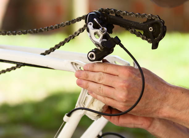 istock Young Man Checking and Cleaning Bicycle Brake´s Area 1152143347