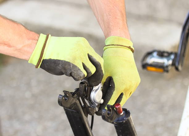 istock Young Man Checking and Cleaning Bicycle Brake´s Area 1152143358