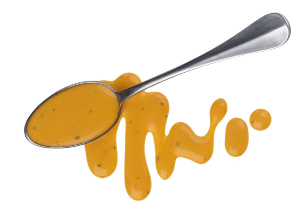 istock Mustard sauce, honey salad dressing with spoon isolated on white background, top view 1152144330