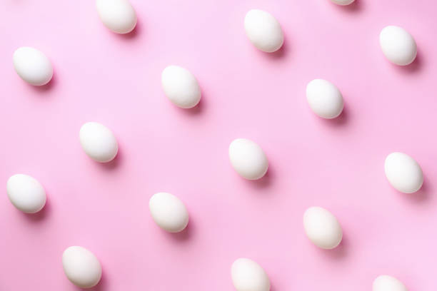 istock Food concept with white chicken eggs on pink background. Top view. Creative pattern in minimal style. Flat lay. 1152145636