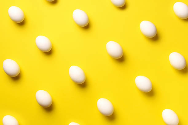 istock Food concept with white chicken eggs on violet background. Top view. Creative pattern in minimal style. Flat lay. 1152145646