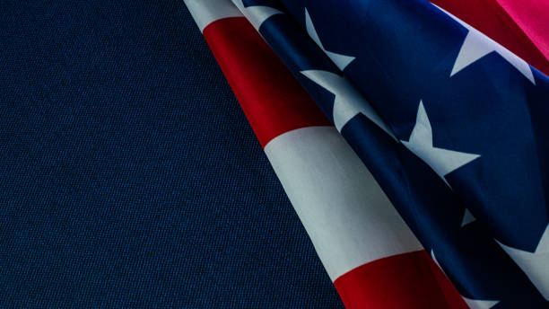 istock American flag on blue  independence day content. 1152147295