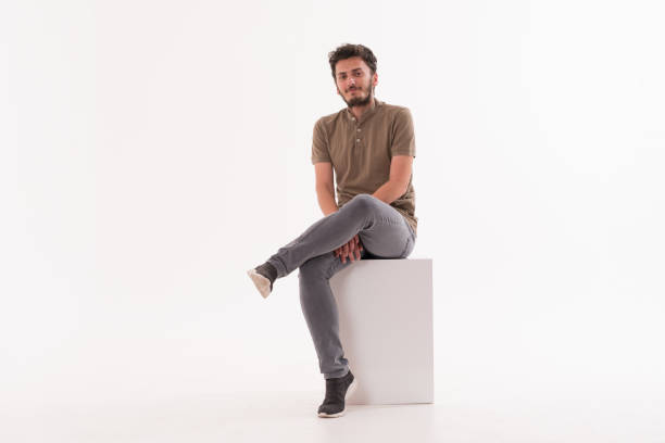 istock Handsome young man smiling against white background 1152149826