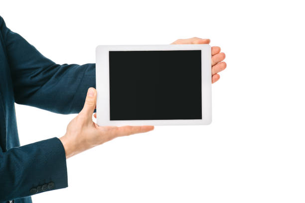 istock partial view of businessman showing digital tablet with blank screen isolated on white 1152151096
