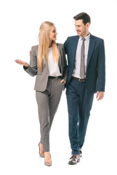 istock successful smiling businesspeople posing in suits isolated on white 1152151258