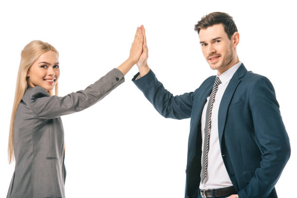 istock successful businesspeople giving highfive isolated on white 1152151317