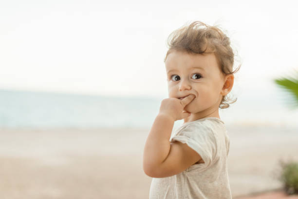 istock Cute little girl on the beach 1152155683