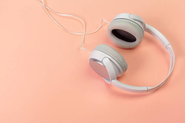 istock headphones on orange  background 1152156728