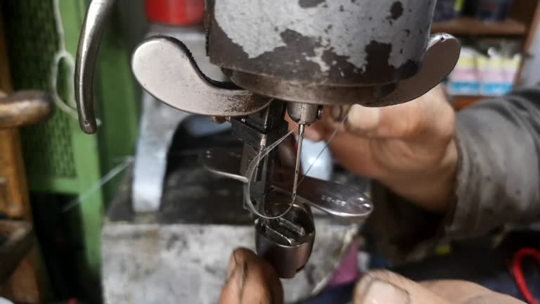 Shoe maker is repairing shoe