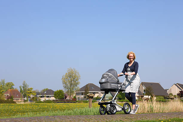 istock Young Mother With Baby Stroller 115215925