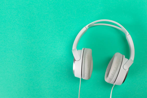 istock Headphones on green background 1152160098