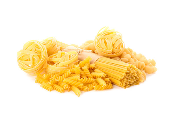 istock Pasta isolated on white background. Uncooked whole wheat pasta 1152160946
