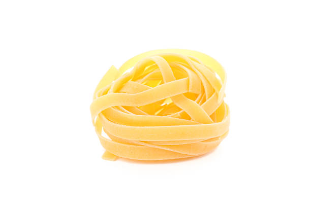 istock Pasta isolated on white background, closeup. Dry uncooked whole pasta 1152162144