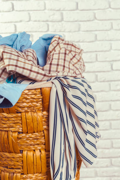 istock Clothes in wooden basket 1152162219