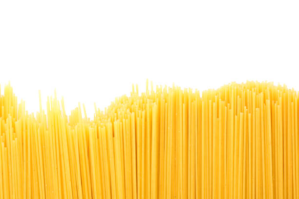 istock Pasta isolated on white background. Uncooked whole wheat pasta 1152163472